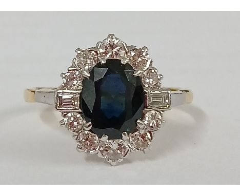Tested as 18ct gold sapphire &amp; diamond cluster ring, central sapphire approx. 1.30ct surrounded by approx. 0.25ct of diam