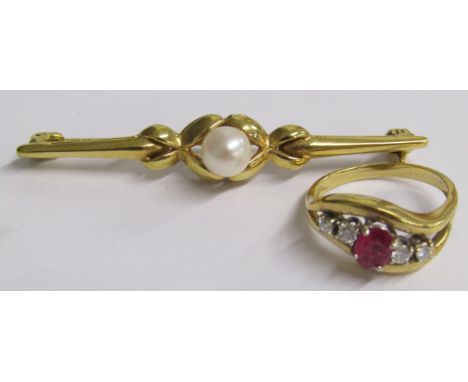 Tested as 18ct gold ring set with central ruby and flanked either side by 2 diamonds - ring size H/I - total weight 2.4g also