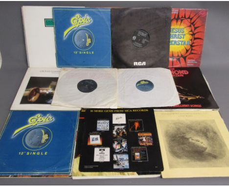 Collection of vinyl LP records includes Amy Winehouse Back to Black, Specials, Fuse one, Rah Band and 12" singles including M