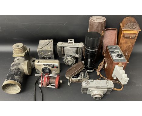 Top view telescope, old cameras, Korvette telephoto lens,&nbsp; wooden money box, cine camera, light meter &amp; a fishing re