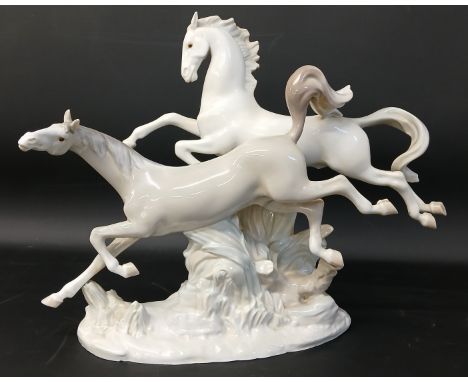 Large Lladro galloping horses figurine on naturalistic base, impressed mark to base, approx. 37cm wide