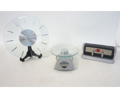 SOEHNLE OF SWITZERLAND electronic kitchen scales, a circular glass wall clock and a Sushi rolling machine