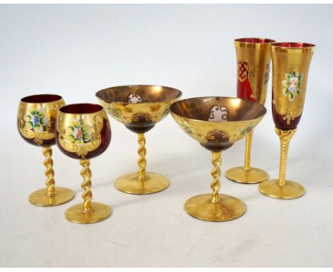 COLLECTION OF BOHEMIAN DRINKING GLASSES
comprising six brown glass champagne coupes, six ruby glass champagne flutes and six 