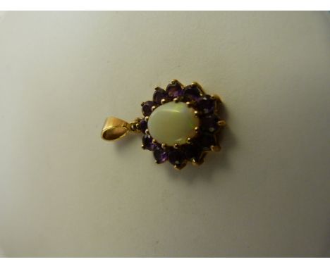 9ct Gold Amethyst and Opal pendant. The Centre opal approx 10mm x 8mm and is surrounded by 12 approx 3.25 diameter beautiful 