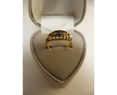 A Good Diamond and Sapphire ring set in 18ct Gold