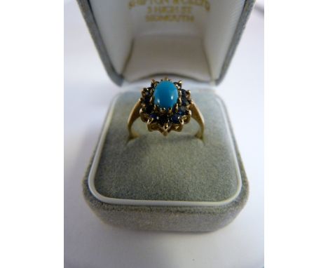 Vintage 1980's 9ct Yellow Gold Sapphire and Turquoise cluster ring - The centre oval cabachon Turquoise stone is approx 7.2mm