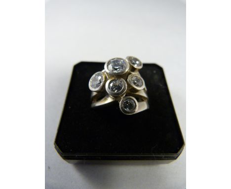 Silver contemporary ring set with six CZ stones.  Size K UK, 5 1/8 USA