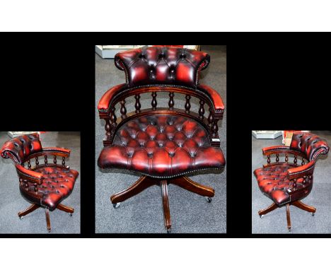 Leather Swivel Captains Chair, Button back oxblood leather with upholstered back rest and seat, swivel base with castors. Hei