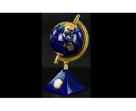 Small Decorative Globe and Clock.  Attractive globe in deep blue and gold, on pyramid base containing small clock.  Unusual i