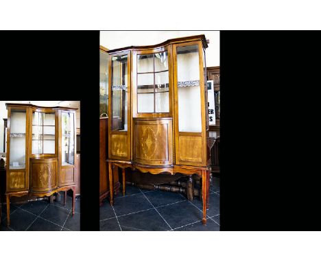 An Edwardian Bow Fronted Display Vitrine Impressive Display Cabinet with central convex cupboard and glazed drawer to front r