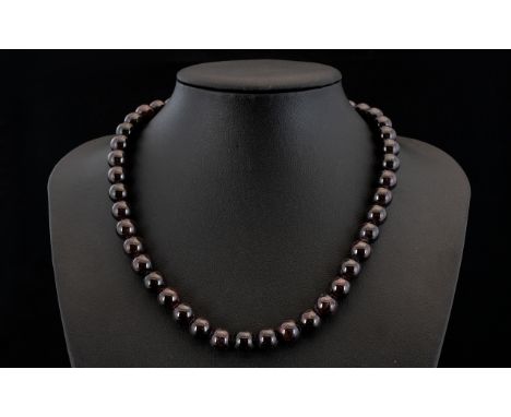 Natural Mozambique Garnet Round Bead Necklace, a large carat weight of smooth, round, dark cherry red garnets, threaded and f