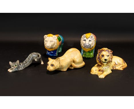 A Collection Of Ceramic Art Pottery Feline Figures Five in total a varied lot to include a pair of hand painted South African