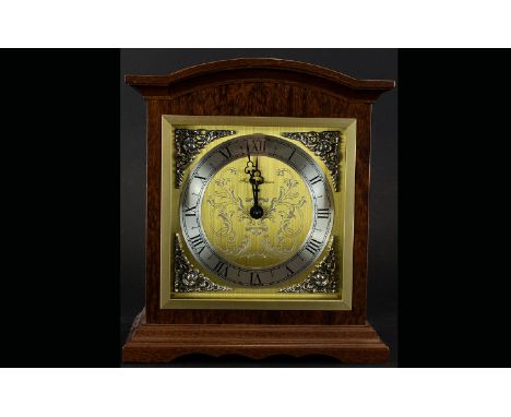 A Modern Reproduction Mantle Clock Wooden cased with etched and brushed gold tone face and silver tone dial with Roman numera
