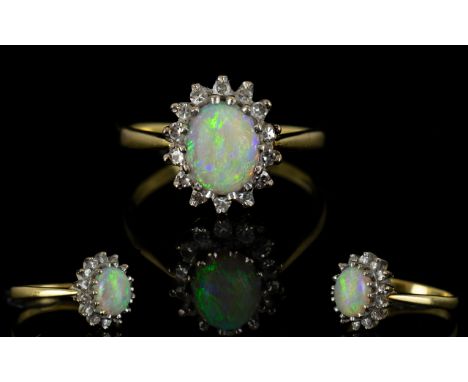 18ct Gold Opal and Diamond Cluster Ring, Flower head Setting, The Central Opal Surrounded by 16 Diamonds. Est Diamond Weight 