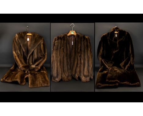 A Collection of Three Fur Coats, to include:  Golden Brown Mink Evening Cape, fully lined.  Also Long Full Length Brown Mink 