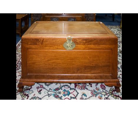 A Modern Oriental Style Chest - Raised on bracket feet,of plain form with ornamental etched brass lock. 39 inches wide, 23 x 