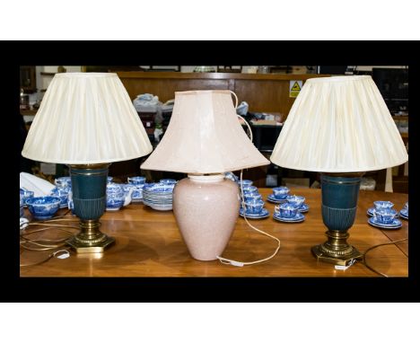 A Pair Of Neoclassical Style Table Lamps Each with verdigris tone urn form on hexagonal brass base, each with cream satin pin