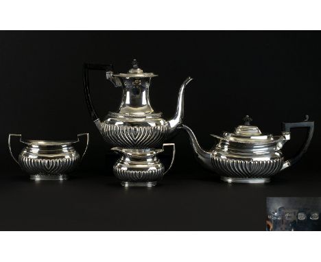 Victorian Period 4 Piece Solid Silver Tea and Coffee Set of Good Proportions with Half Ribbed Bodies, Swan Neck Spouts, Reede