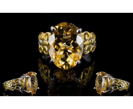 Citrine Solitaire Ring, 8cts of clear, warm citrine, oval cut and set in a 14ct gold and rhodium vermeil and silver mount, th