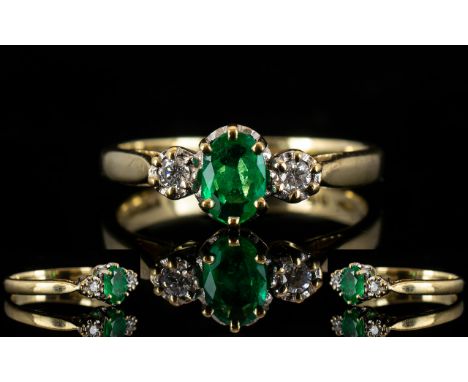 Ladies - Attractive 9ct Gold Emerald and Diamond Set Ring, The Central Oval Shaped Faceted Emerald of Good Colour. Flanked by