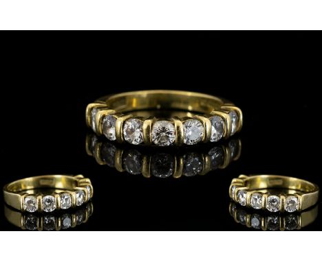 18ct Yellow Gold Diamond Set Half Eternity Ring of Attractive Form. Fully Hallmarked for 750 - 18ct. The Seven Brilliant Cut 