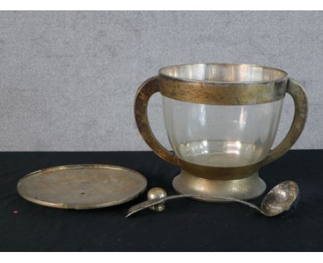 An Art Deco silver plate mounted twin handled glass punch bowl and ladle. H.17 W.38 D.28cm 