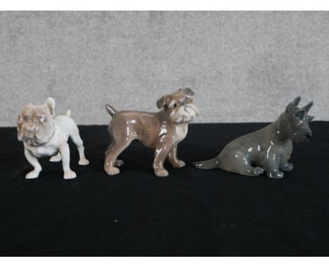 A  Royal Copenhagen porcelain seated dog with painted marks to base, together with two other Copenhagen porcelain seated dogs