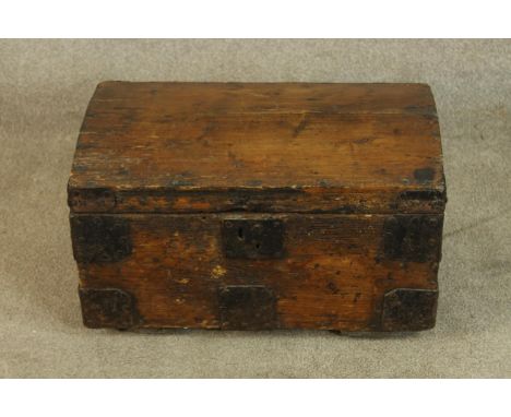 A 19th/early 20th century pine trunk with applied iron work strapwork. H.31 W.57cm. 