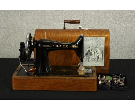 A 20th century mahogany cased manual sewing machine. H.33 W.43 D.20cm. 