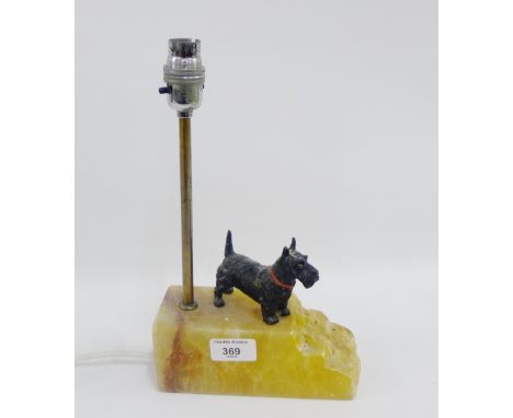 Hardstone table lamp base surmounted by a cold painted Spelter Scottie Dog figure, height overall 30cm 