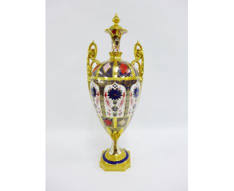 Royal Crown Derby Old Imari pattern 1128 urn and cover with domed finial and handles to side, raised on a pedestal base, with