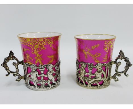 Pair of Copeland Spode pink glazed porcelain cabinet cups each within a Mappin &amp; Webb silver cup holder, Sheffield 1899, 