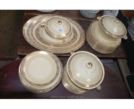 A Crown Devon gold and cream Dinner service including graduated meat plates, dinner plates, tea plates, vegetable dishes, etc