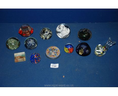 A quantity of glass paperweights including a Caithness snowball