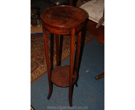 A dark wood circular Lamp/Jardiniere Stand having the four legs united by a lower tier.  38" high, 12 1/2" diameter.