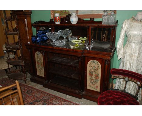 A fine Victorian Rosewood breakfront, mirror backed Sideboard, the pillared detail base having a flight of central open shelv