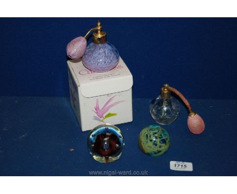 A Caithness perfume bottle, boxed with one other and two paperweights
