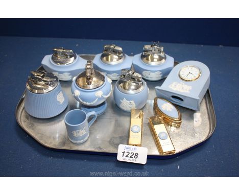 Six light blue Wedgwood jasperware table lighters, two zodiac sign lighters, small mantle clock, etc   