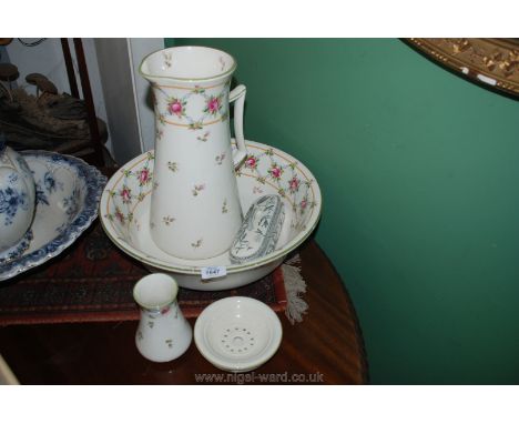 A Minton wash bowl, large water jug, soap dish and toothbrush pot together with a Poole pale green toothbrush holder
