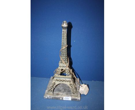 An Eiffel Tower lamp with marble base