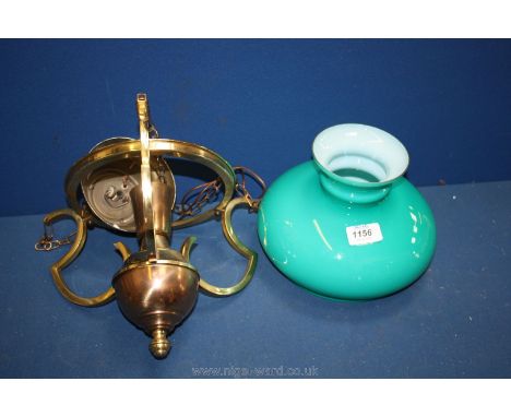 A turquoise glass and brass ceiling Light