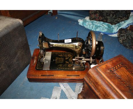 A Frister & Rossmann 1174062 manual sewing Machine in inlaid case