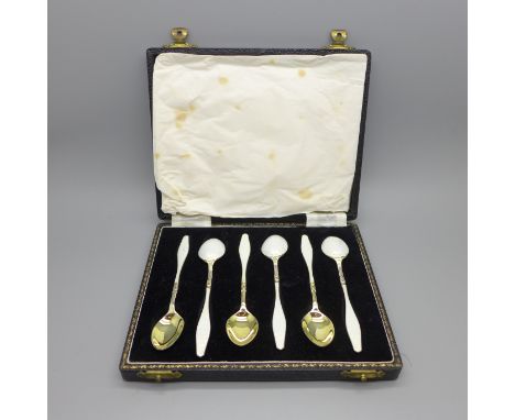 A cased set of six silver and enamel spoons, one with shallow chip to the enamel 