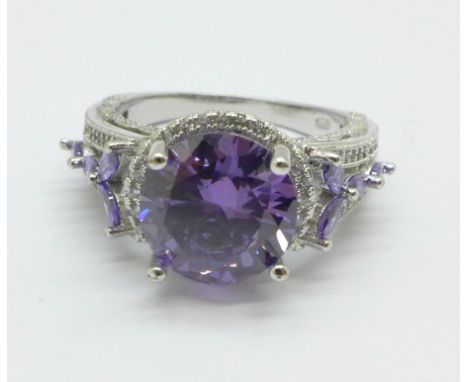 A large silver and purple stone ring, 8.4g, X 