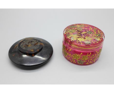 A cranberry glass pot and a tortoiseshell compact decorated with an oriental dragon, a/f 