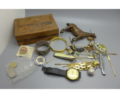 A puzzle box, a cold painted model of a horse, a silver napkin ring, 32g, an Albertina chain with faith, hope and charity cha