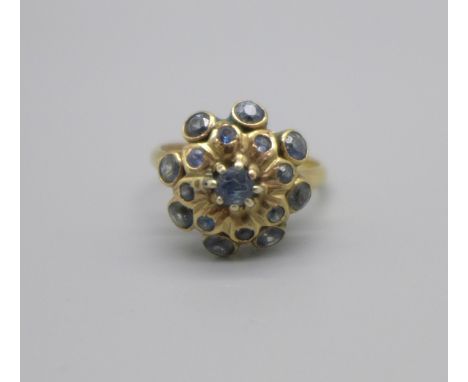 An 18ct gold and blue stone cluster ring, 4.0g, M 