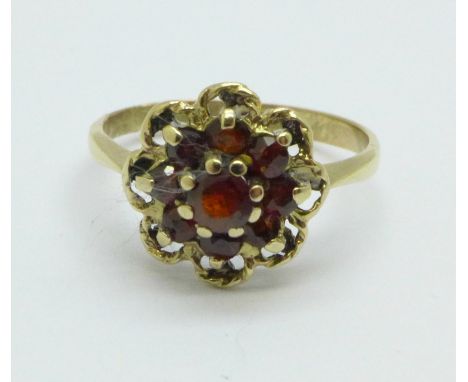 A 9ct gold and garnet cluster ring, 1.6g, J 