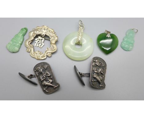 Four jade pendants, a brooch and a pair of cufflinks 