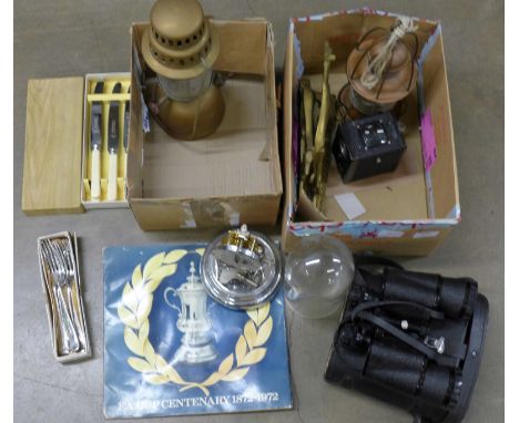 A pair of binoculars, an anniversary clock, a pair of fireplace dogs, two lamps, one glass a/f, a camera, flatware and F.A. C